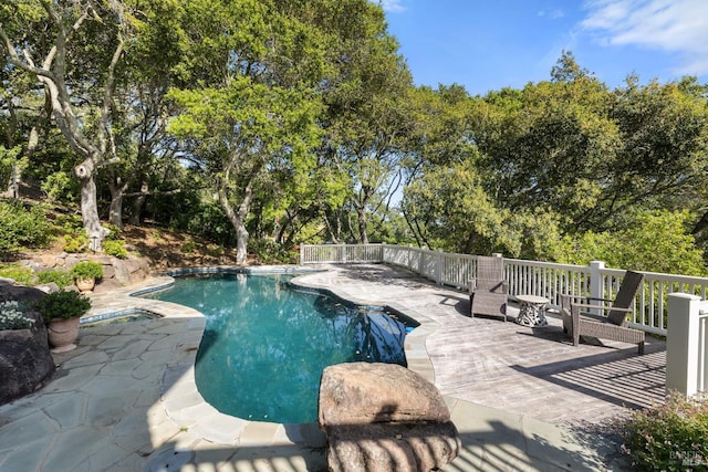 outdoor pool with a patio area