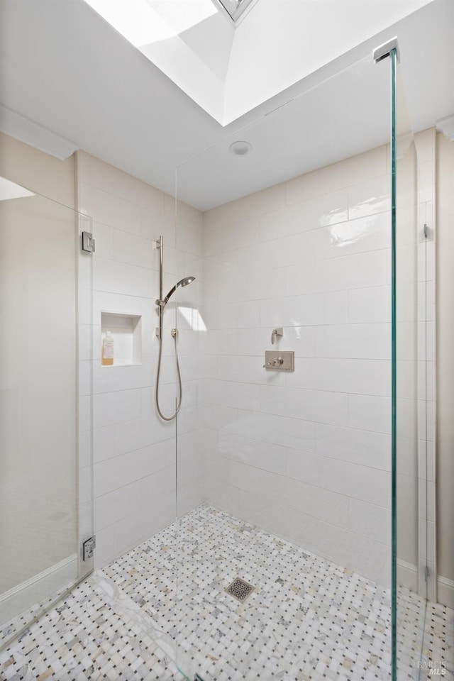 full bath with baseboards, a shower stall, and tile patterned floors