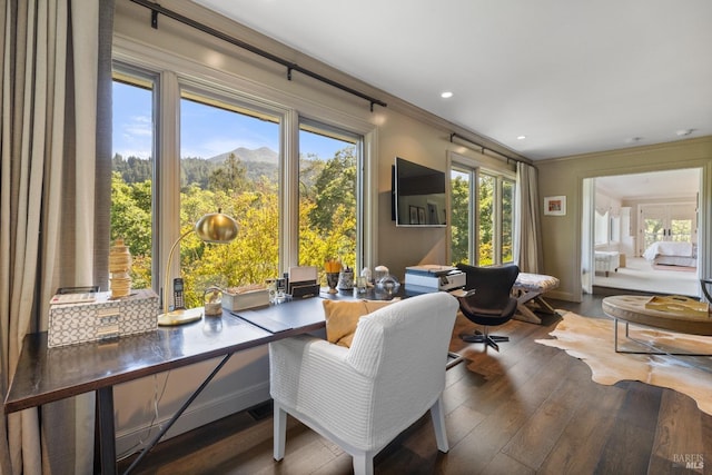 interior space with recessed lighting, ornamental molding, and wood finished floors