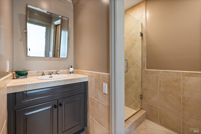 bathroom with vanity and a shower stall