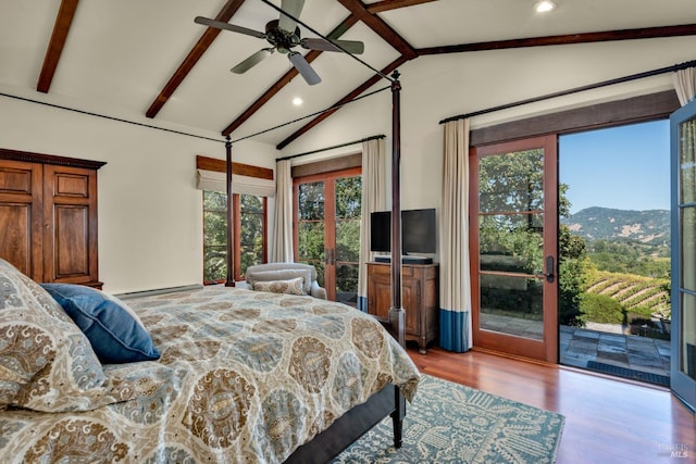 bedroom featuring baseboard heating, lofted ceiling with beams, recessed lighting, access to exterior, and wood finished floors
