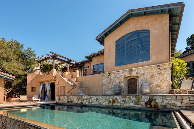 pool featuring a patio and a pergola