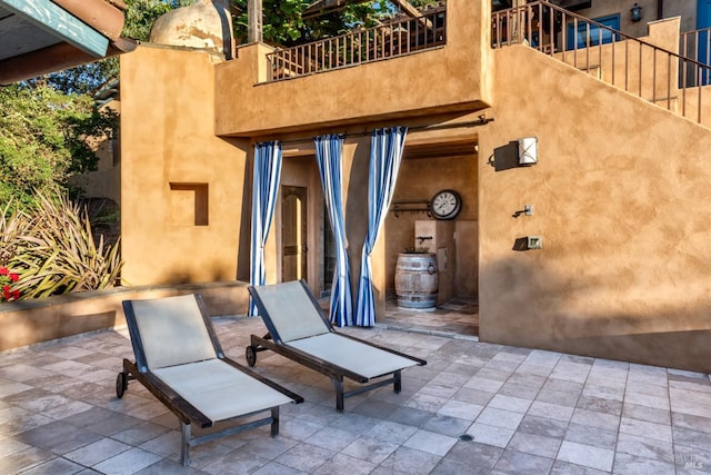 view of patio / terrace with a balcony