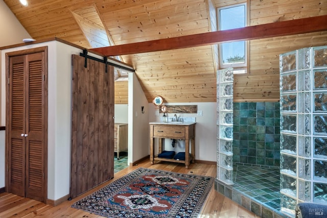 bathroom featuring a walk in shower, wood ceiling, wood finished floors, a sink, and vaulted ceiling with beams
