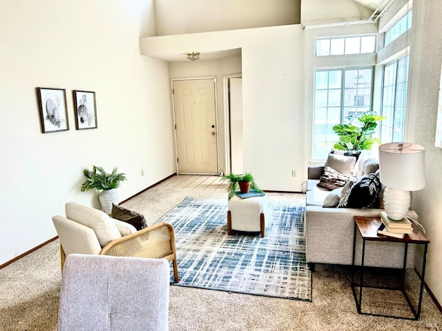 261 Bridgewater Cir, Suisun City, CA 94585 - living room featuring high vaulted ceiling, baseboards, and carpet floors