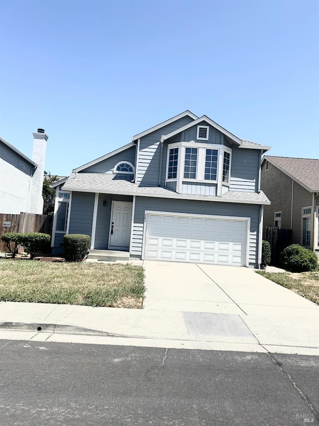 261 Bridgewater Cir, Suisun City, CA 94585 - view of front of home featuring an attached garage, driveway, and board and batten siding