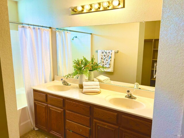 261 Bridgewater Cir, Suisun City, CA 94585 - full bathroom featuring double vanity, shower / tub combo with curtain, and a textured wall