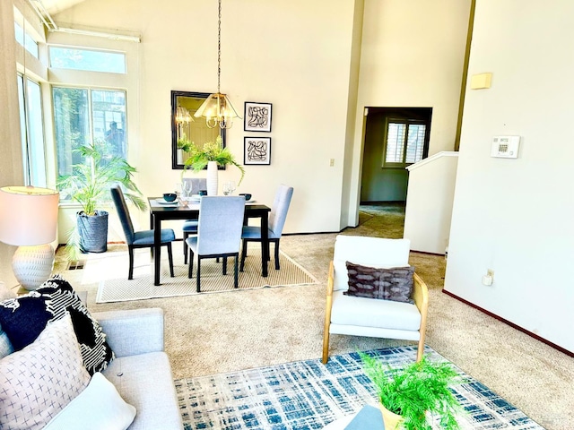 261 Bridgewater Cir, Suisun City, CA 94585 - dining space featuring a high ceiling, carpet, a chandelier, and baseboards