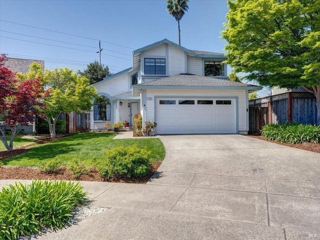 view of front of home with driveway, a front lawn, a garage, fence, and a shingled roof