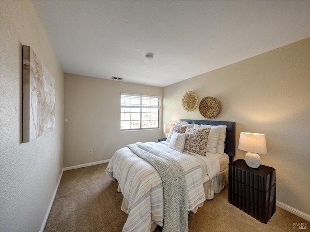 bedroom featuring baseboards, visible vents, and carpet floors