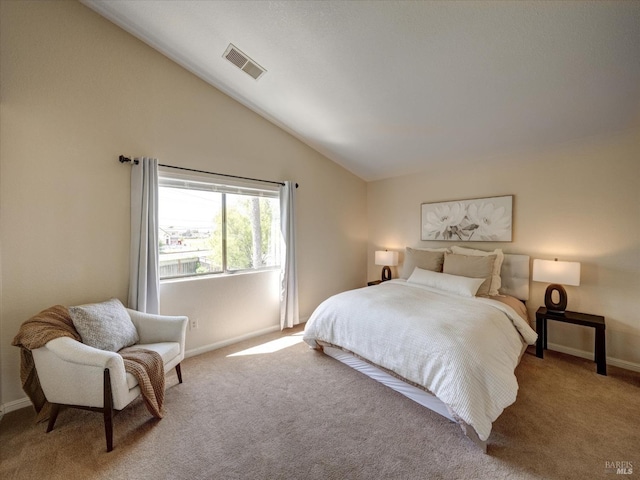 carpeted bedroom with visible vents, baseboards, and high vaulted ceiling