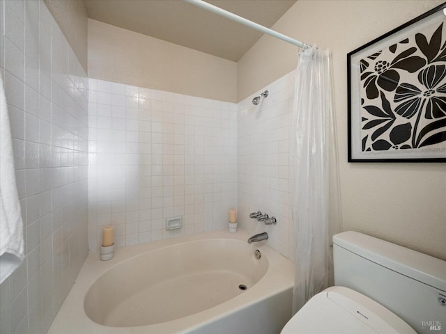bathroom with toilet and shower / bath combo