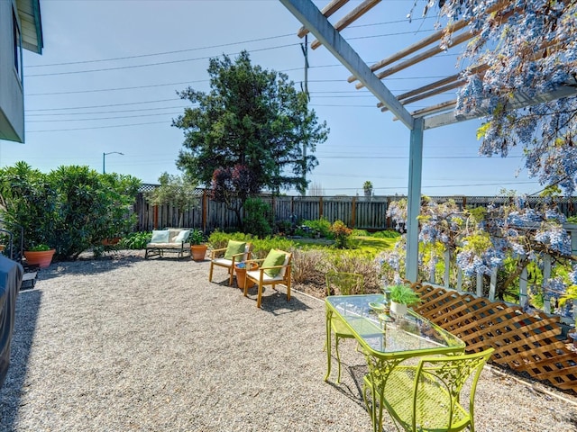 view of yard featuring a pergola, fence private yard, and a patio area