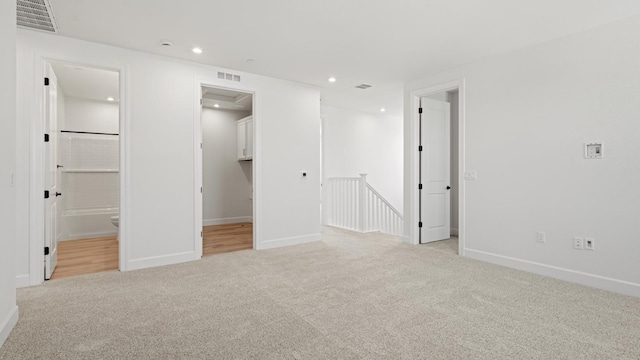 unfurnished bedroom featuring carpet flooring, recessed lighting, baseboards, and visible vents