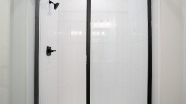 room details featuring a shower stall