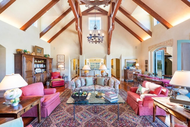 living area featuring beamed ceiling, a wealth of natural light, arched walkways, and a chandelier