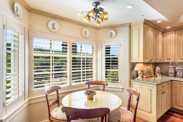 dining space featuring an inviting chandelier, recessed lighting, ornamental molding, and a healthy amount of sunlight