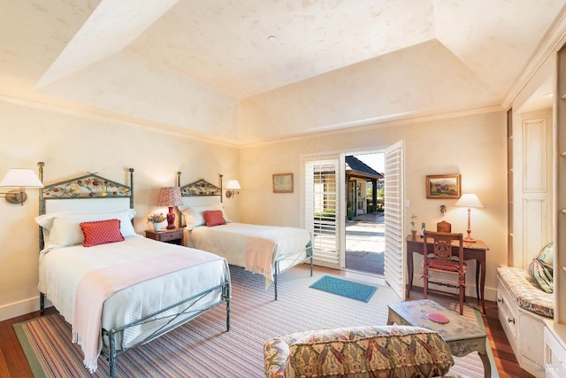 bedroom with access to outside, baseboards, crown molding, a tray ceiling, and wood finished floors