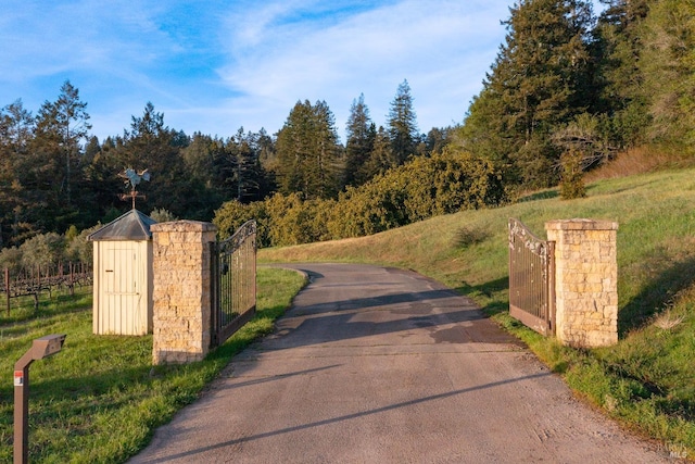 view of road featuring a gate