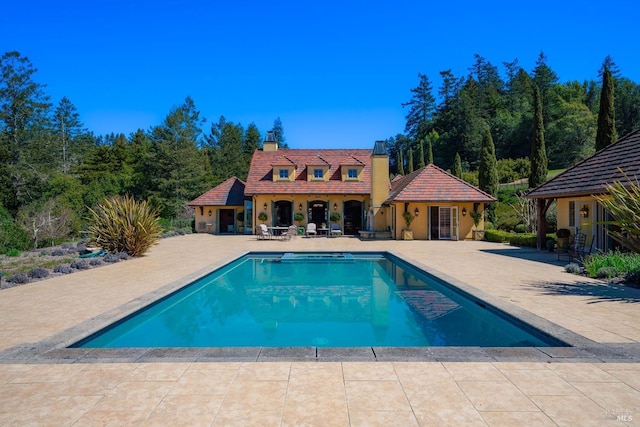 outdoor pool with a patio
