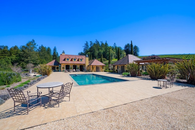 outdoor pool featuring a patio and a pergola