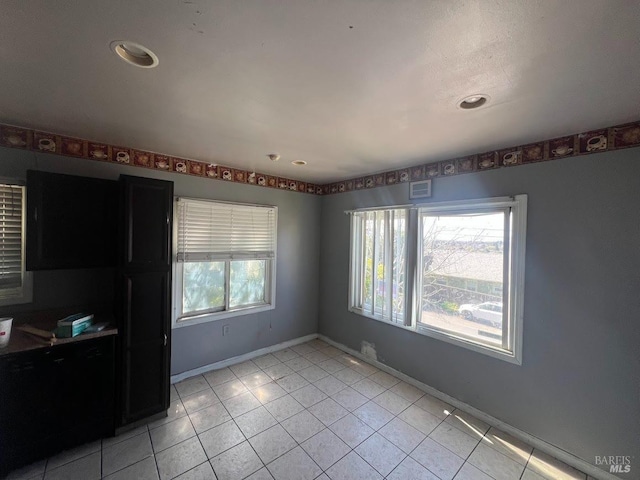 interior space with light tile patterned flooring, baseboards, recessed lighting, and visible vents