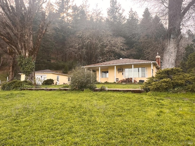 78951 Zenia Rd, Covelo, CA 95428 - single story home with a chimney, a front lawn, and stucco siding