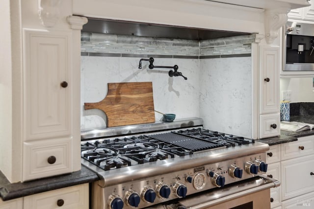 240 Del Casa Dr, Mill Valley, CA 94941 - kitchen featuring stainless steel stove, white cabinetry, backsplash, and dark countertops