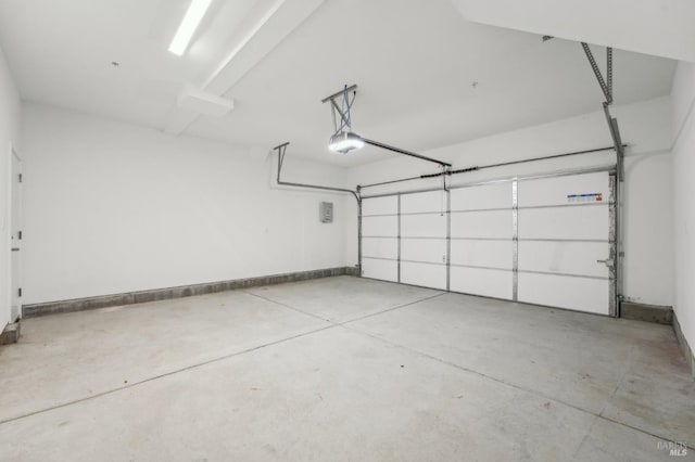 garage featuring baseboards and a garage door opener