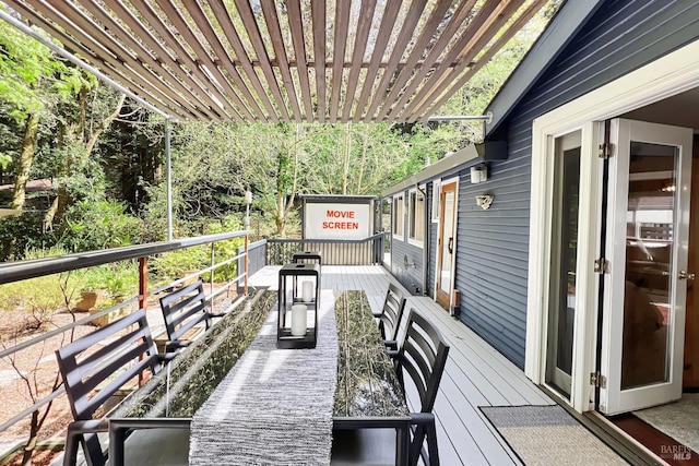 wooden deck featuring a pergola