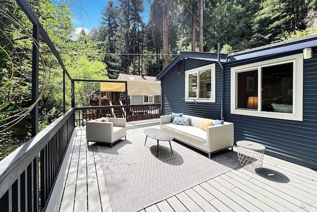 deck featuring outdoor lounge area