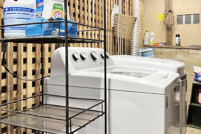 laundry room featuring washing machine and dryer and laundry area