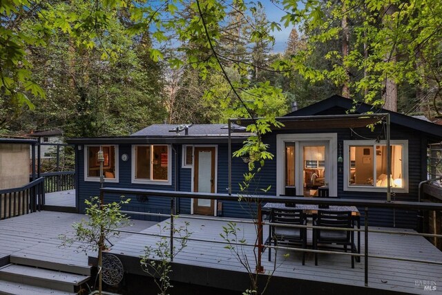rear view of property with a deck