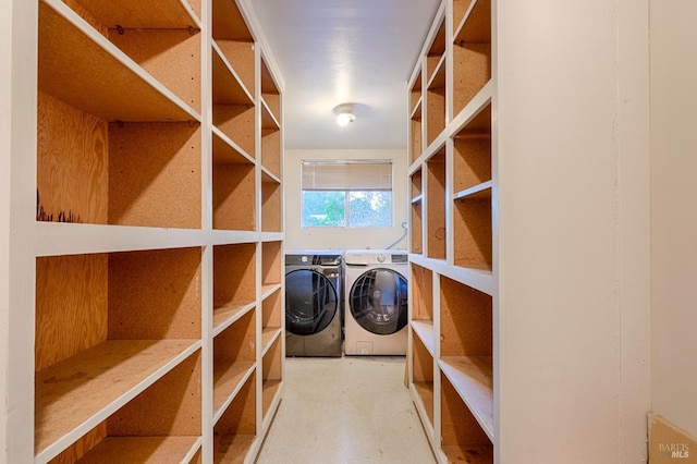 storage room featuring separate washer and dryer