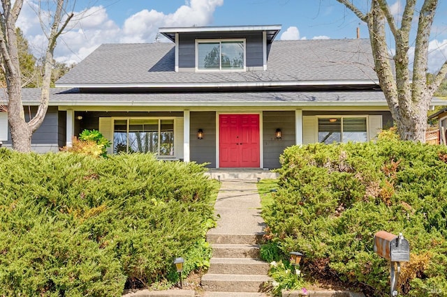 view of front of home featuring a porch and roof with shingles