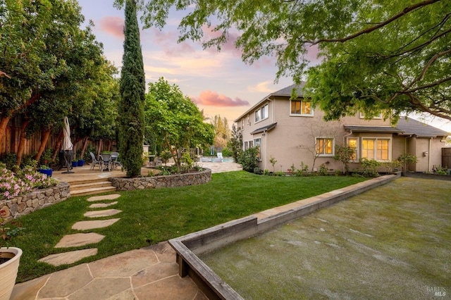 view of yard with a patio and fence
