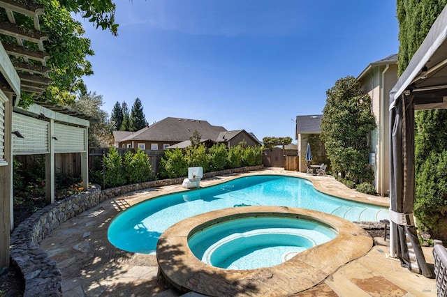 view of pool featuring a patio, a fenced backyard, a fenced in pool, and an in ground hot tub