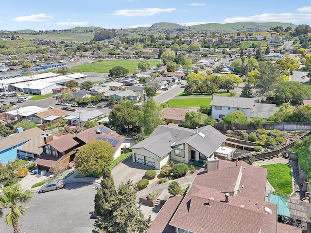 drone / aerial view with a residential view and a mountain view