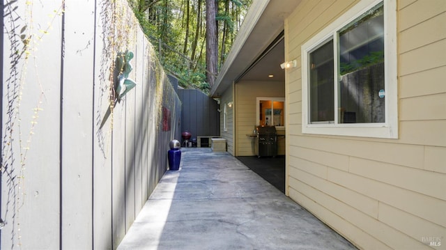 view of side of property featuring a patio area