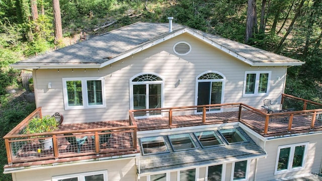 exterior space with a shingled roof