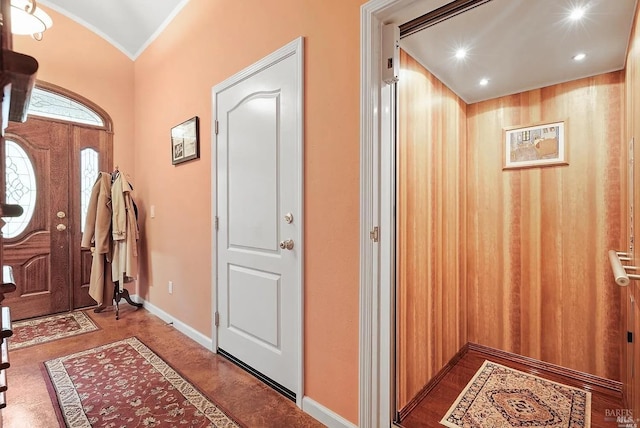 entrance foyer with baseboards, recessed lighting, and vaulted ceiling