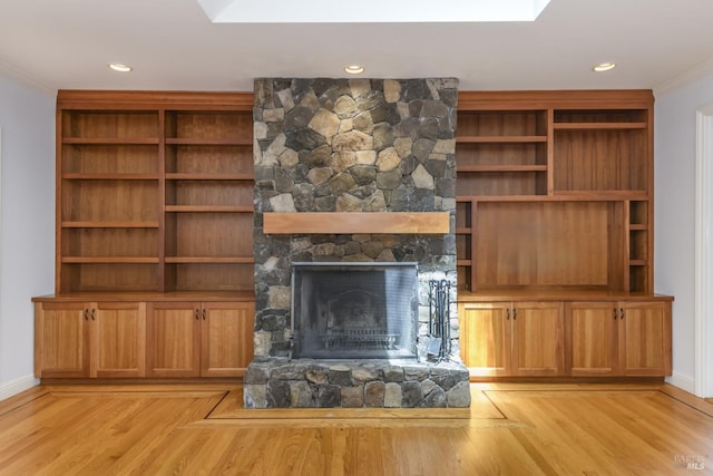 1065 Meadowsweet Dr, Corte Madera, CA 94925 - unfurnished living room featuring light wood-style floors, crown molding, baseboards, and a stone fireplace
