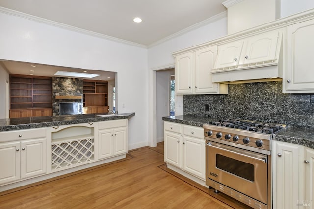 1065 Meadowsweet Dr, Corte Madera, CA 94925 - kitchen with a sink, ornamental molding, light wood-style floors, luxury range, and decorative backsplash