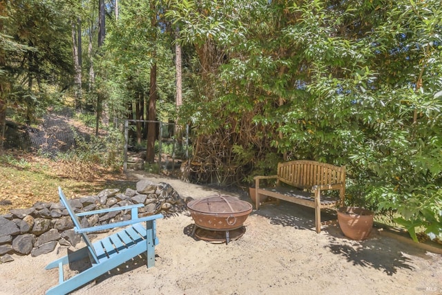 1065 Meadowsweet Dr, Corte Madera, CA 94925 - view of patio / terrace with an outdoor fire pit and fence
