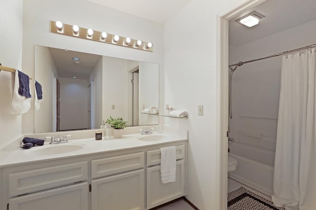 full bath with shower / bathtub combination with curtain, toilet, double vanity, and a sink