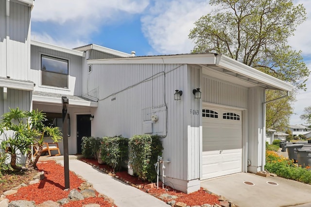 view of property exterior with driveway