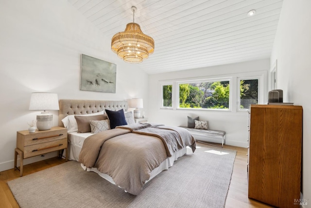 1423 Butterfield Rd, San Anselmo, CA 94960 - bedroom with a chandelier, lofted ceiling, wood finished floors, wooden ceiling, and baseboards