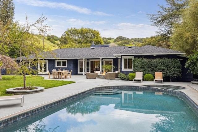 1423 Butterfield Rd, San Anselmo, CA 94960 - rear view of property with outdoor lounge area, a patio, a yard, a pool with connected hot tub, and a shingled roof