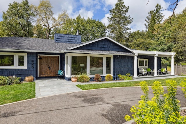 1423 Butterfield Rd, San Anselmo, CA 94960 - ranch-style house featuring a porch, roof with shingles, and fence