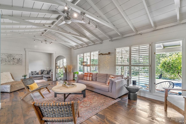 living area featuring hardwood / wood-style flooring, ceiling fan, beam ceiling, high vaulted ceiling, and wooden ceiling